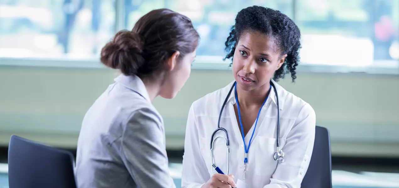 Doctor and patient discussing breast cancer